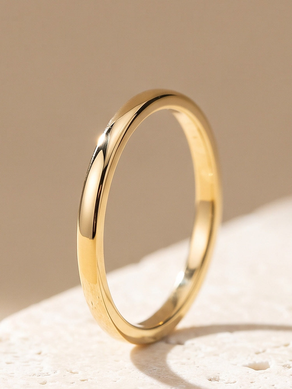 Close-up of the polished 2 mm band of the Fine Stacking Ring in gold vermeil