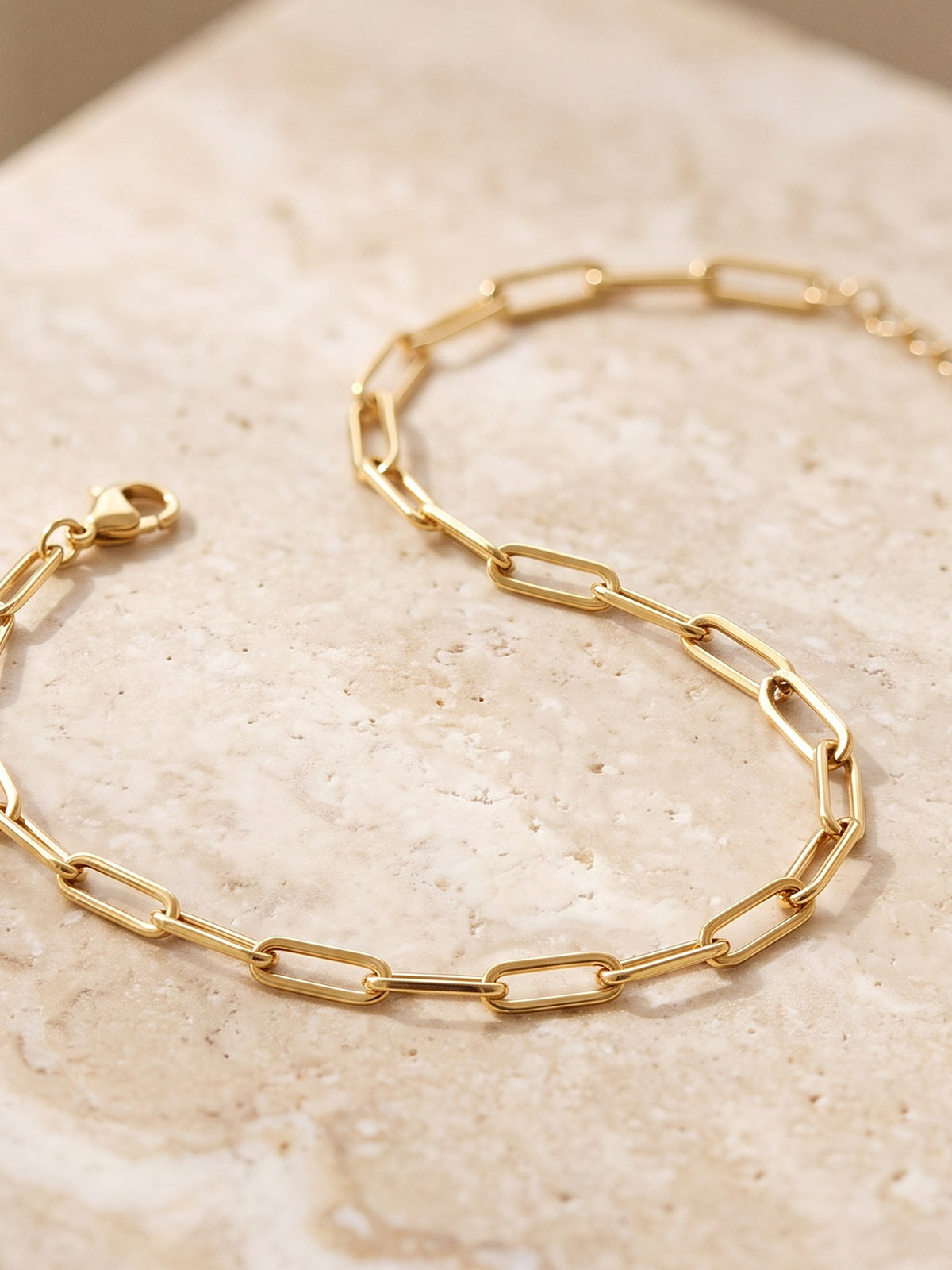 Close-up of the elongated links and lobster clasp of the Paperclip Chain Bracelet